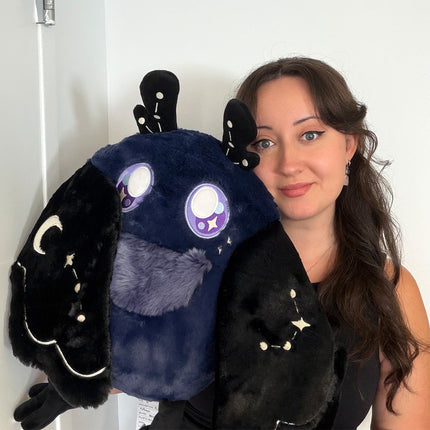 Customer photo of Squishable Midnight Mothman baby plush